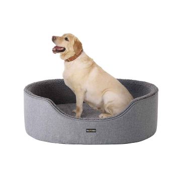 Dog bed with reversible pillow